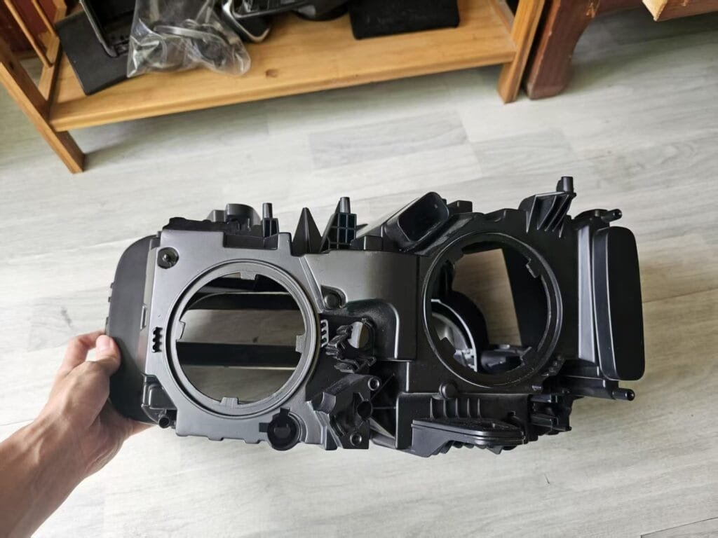 Complete automotive headlamp prototype viewed from an exterior angle