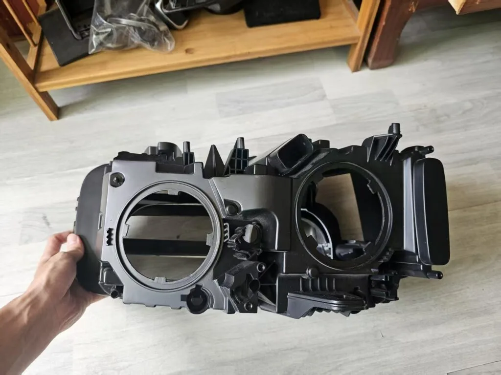 Complete automotive headlamp prototype viewed from an exterior angle