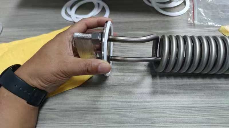 Helical cooling tube assembly with visible coil and connection ends