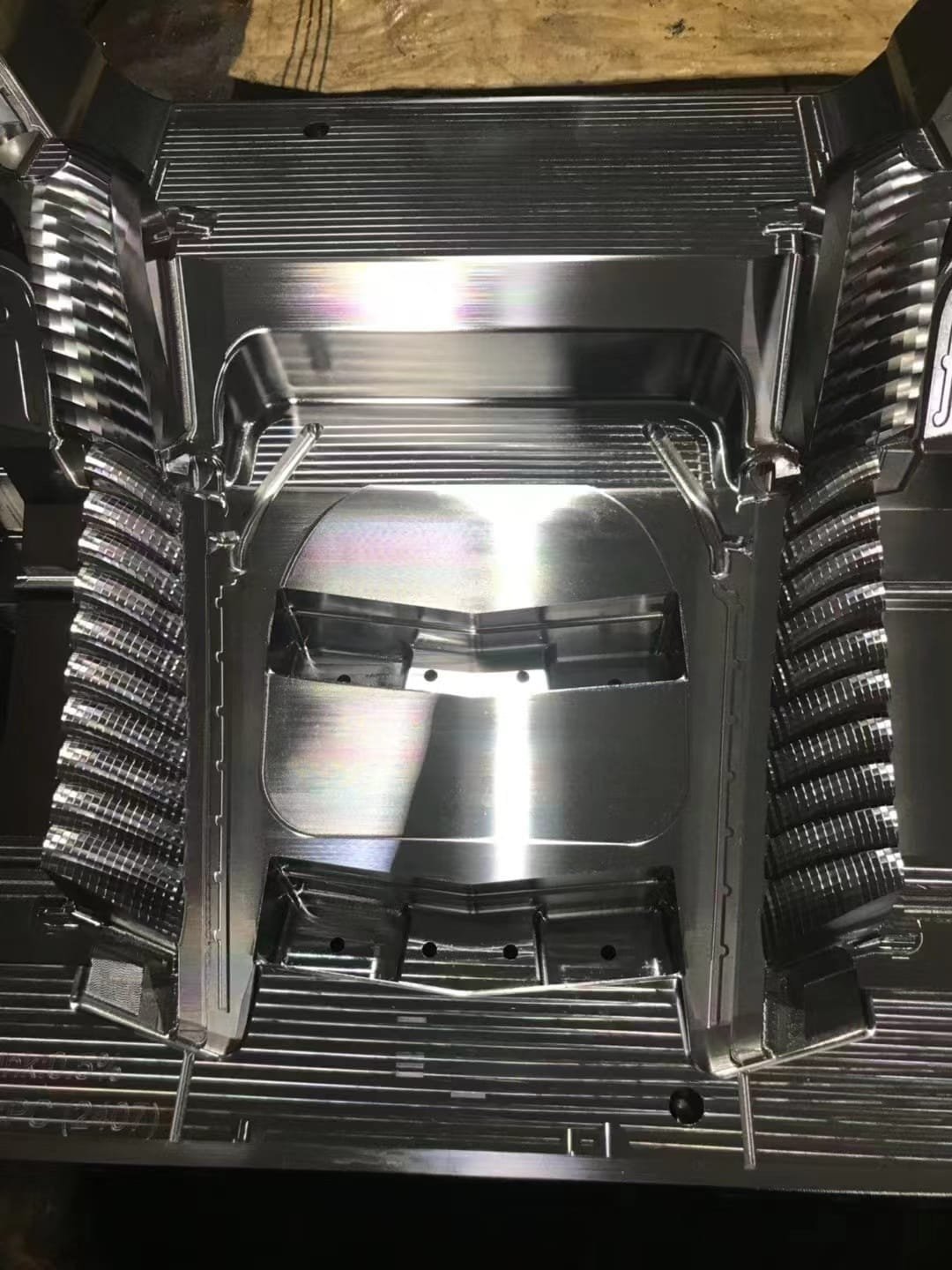 Automotive lighting mold components photographed from multiple views
